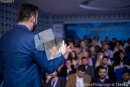 Image of successful businessman giving presentations at conference room