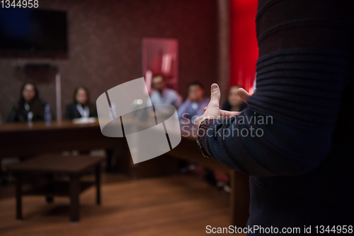 Image of successful businessman giving presentations at conference room