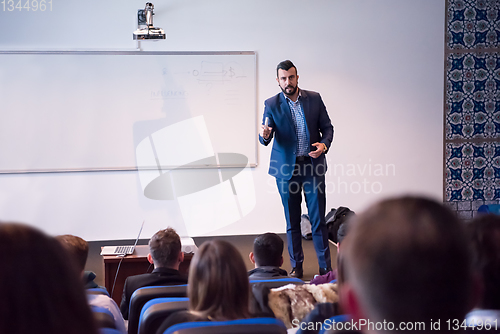 Image of successful businessman giving presentations at conference room