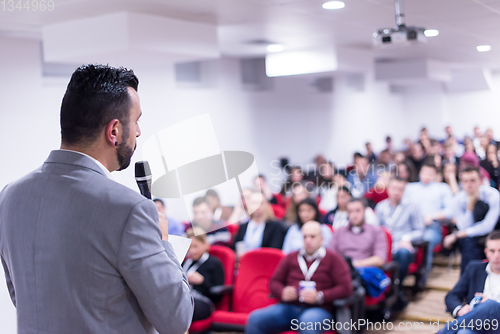 Image of successful businessman giving presentations at conference room