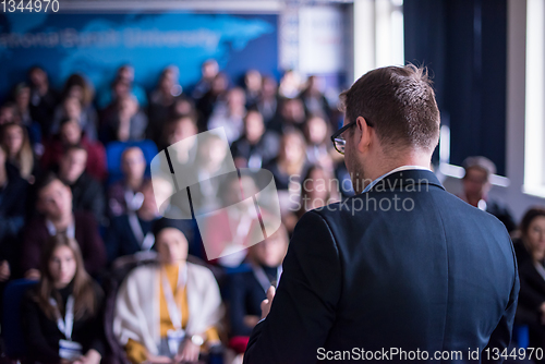 Image of successful businessman giving presentations at conference room