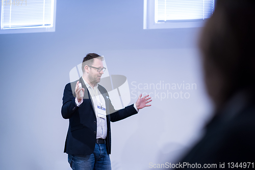 Image of successful businessman giving presentations at conference room