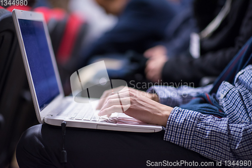 Image of business people hands using laptop computer