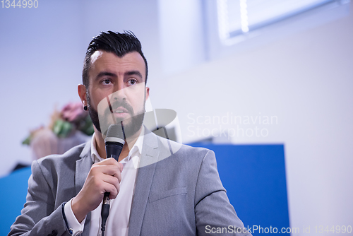 Image of successful businessman giving presentations at conference room