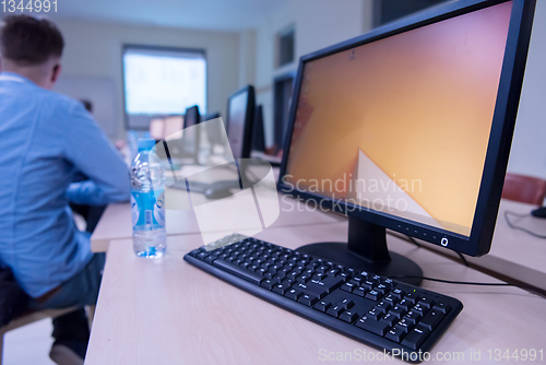 Image of businessman working using a computer in startup office