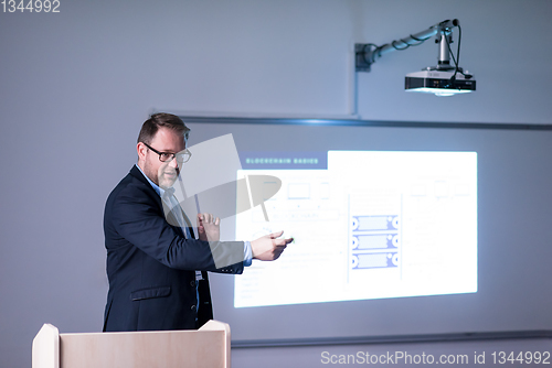 Image of successful businessman giving presentations at conference room