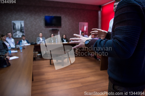 Image of successful businessman giving presentations at conference room