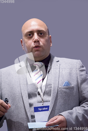 Image of successful businessman giving presentations at conference room