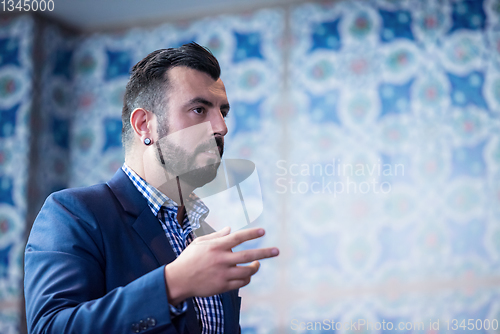 Image of successful businessman giving presentations at conference room