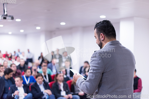 Image of successful businessman giving presentations at conference room