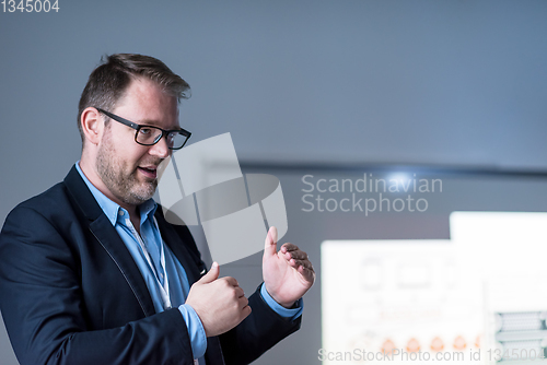 Image of successful businessman giving presentations at conference room