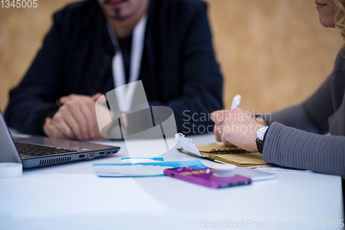 Image of Business woman writing notes