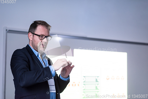 Image of successful businessman giving presentations at conference room