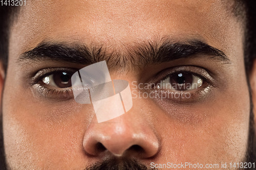Image of Close up portrait of young man on blue background.