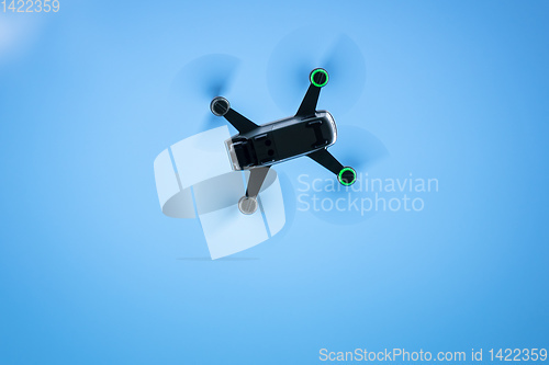 Image of toy drone blue sky background 