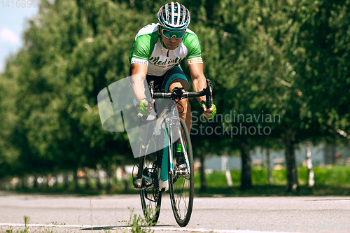 Image of Dnipro, Ukraine - July 12, 2019: athlete with disabilities or amputee training in cycling