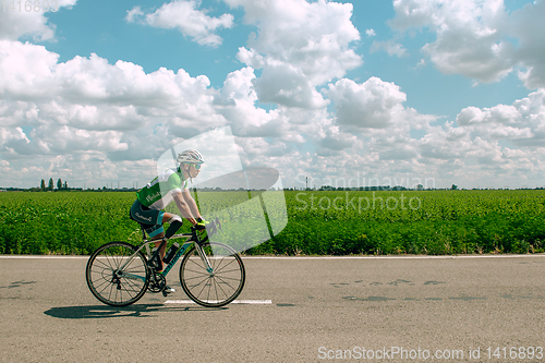 Image of Dnipro, Ukraine - July 12, 2019: athlete with disabilities or amputee training in cycling