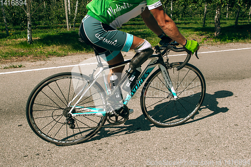 Image of Dnipro, Ukraine - July 12, 2019: athlete with disabilities or amputee training in cycling