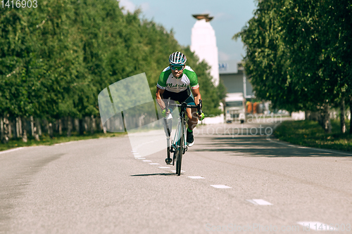 Image of Dnipro, Ukraine - July 12, 2019: athlete with disabilities or amputee training in cycling