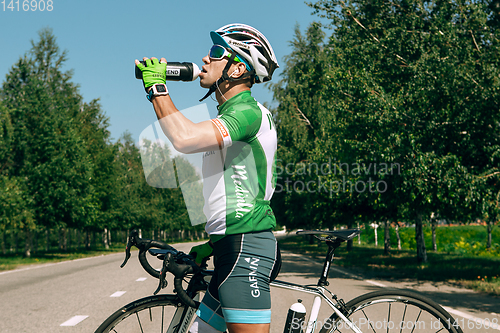 Image of Dnipro, Ukraine - July 12, 2019: athlete with disabilities or amputee training in cycling