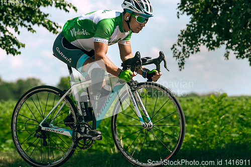 Image of Dnipro, Ukraine - July 12, 2019: athlete with disabilities or amputee training in cycling