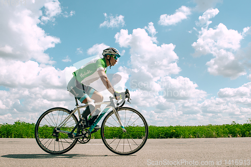 Image of Dnipro, Ukraine - July 12, 2019: athlete with disabilities or amputee training in cycling