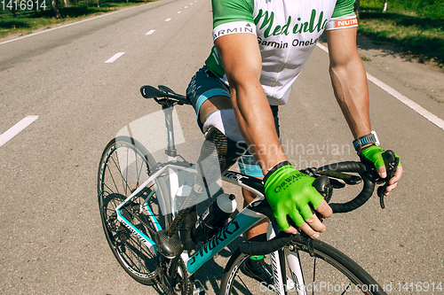 Image of Dnipro, Ukraine - July 12, 2019: athlete with disabilities or amputee training in cycling