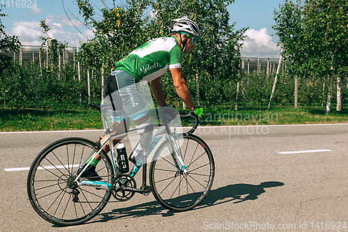 Image of Dnipro, Ukraine - July 12, 2019: athlete with disabilities or amputee training in cycling