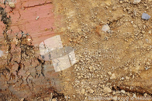 Image of Ground excavations of red and brown clay and yellow earth