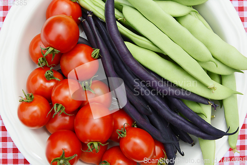 Image of Cherry tomatoes with purple French beans and green Calypso beans