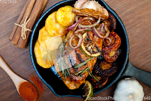 Image of roasted grilled BBQ chicken breast with herbs and spices 