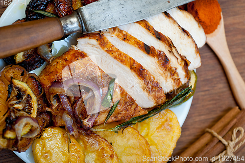 Image of roasted grilled BBQ chicken breast with herbs and spices 