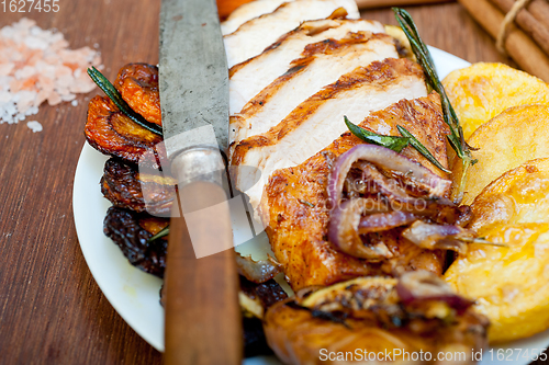 Image of roasted grilled BBQ chicken breast with herbs and spices 