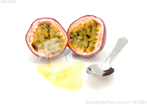 Image of Passion fruit cut in half with juicy pulp and seeds