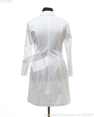 Image of Medical gown hanging on a mannequin, back view, isolated on white background