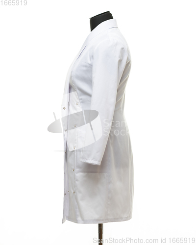 Image of Medical gown hanging on a mannequin, side view, isolated on white background