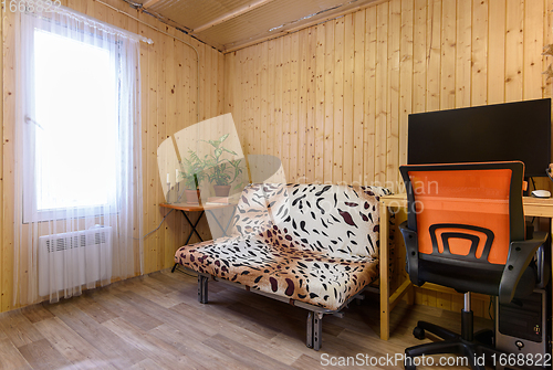 Image of Interior of a small modest room of a country house