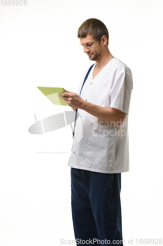 Image of Doctor examines the patient\'s analyzes in a tablet computer