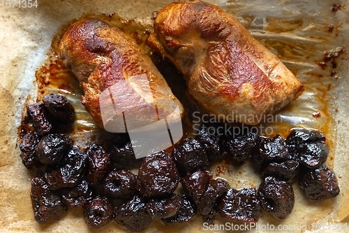 Image of Roast duck breast with plums prepared closeup