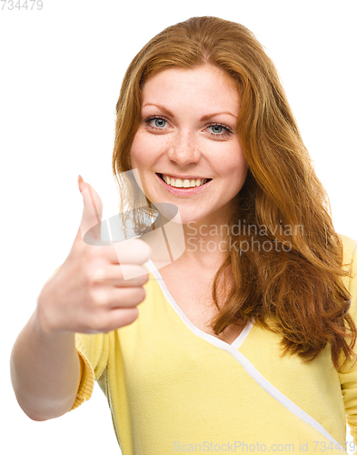 Image of Woman is showing thumb up gesture