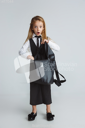 Image of Girl preparing for school after a long summer break. Back to school.