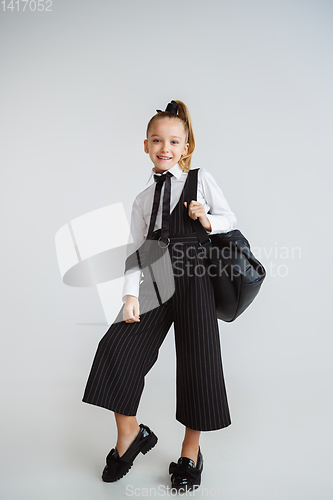 Image of Girl preparing for school after a long summer break. Back to school.