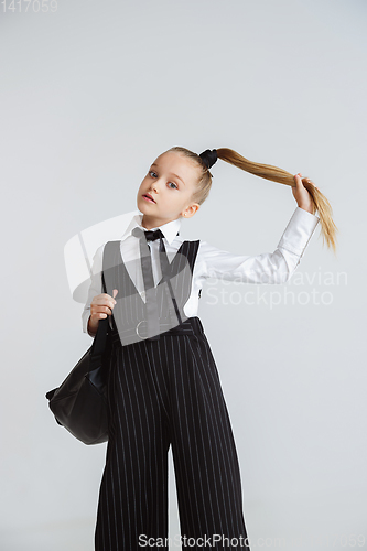 Image of Girl preparing for school after a long summer break. Back to school.