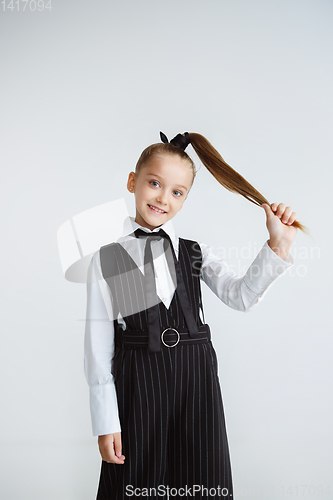 Image of Girl preparing for school after a long summer break. Back to school.