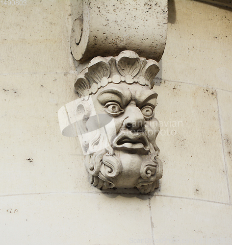 Image of Sculpted stone mask on Pont Neuf in Paris