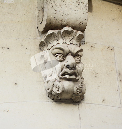 Image of Sculpted stone mask on Pont Neuf in Paris