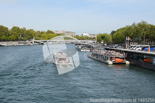 Image of Tourist river cruise ferry full with passengers at the Port de l