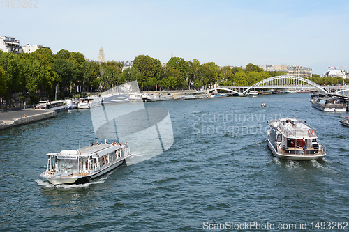 Image of Tourist boat and Batobus ferry sail the Seine in Paris