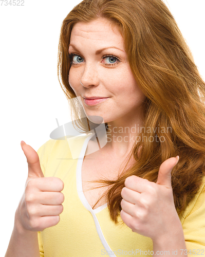 Image of Woman is showing thumb up gesture