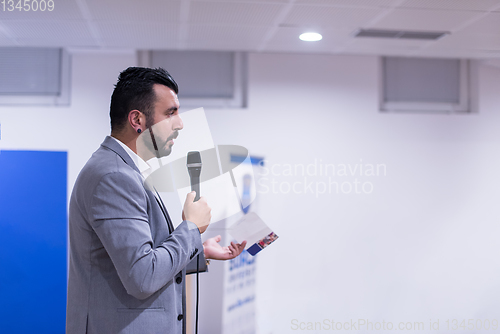 Image of successful businessman giving presentations at conference room